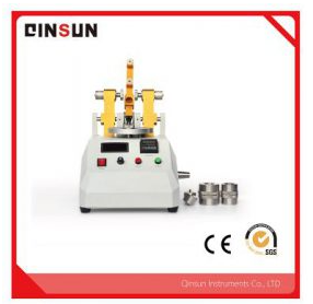 What is a Taber abrasion resistance tester?